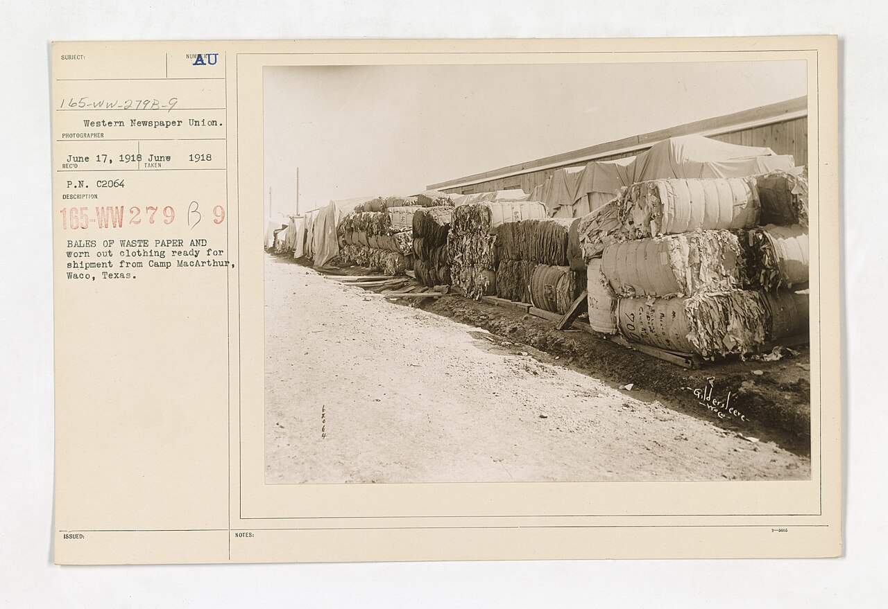 Recovered-fiber bale storage scene illustrating why recycled furnish can change DCS loading