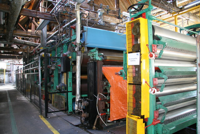 Real Fourdrinier paper machine scene illustrating the equipment and shear environment around a microparticle system